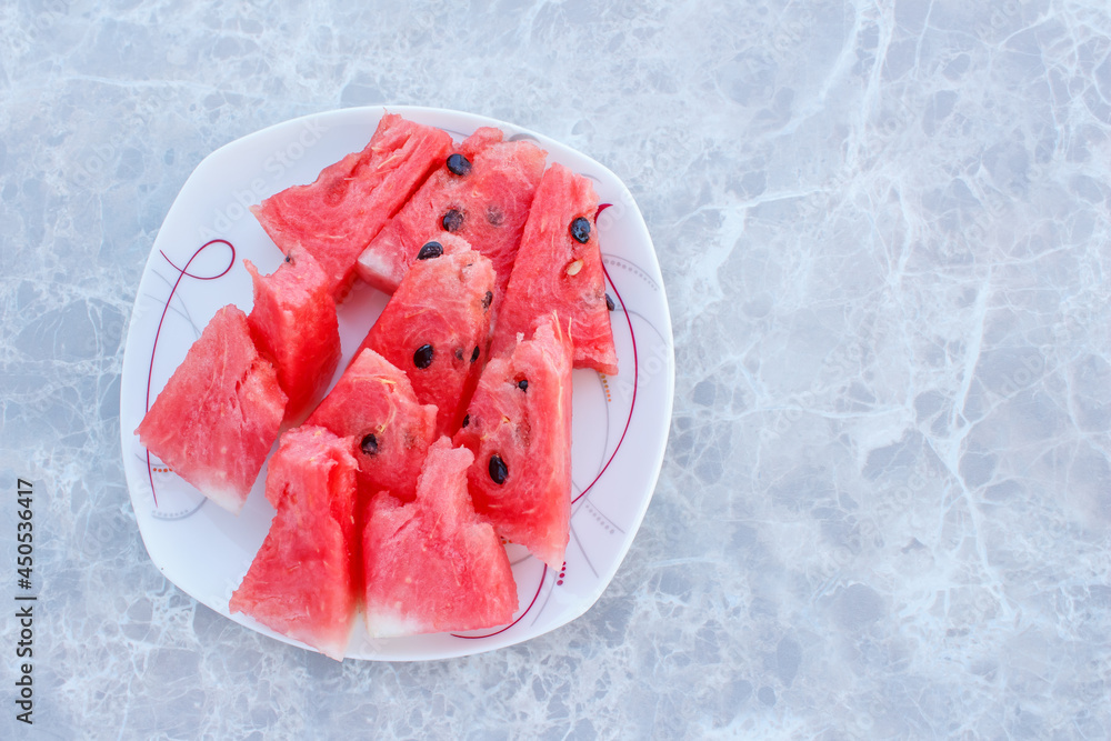 Poster top view of tasty watermelon slices with space for text.