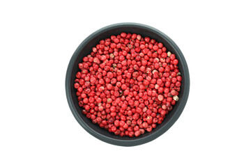 Black bowl of red peppercorns isolated on white background