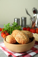 Concept of tasty food with cutlets on gray textured table