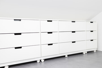 Modern Drawer cabinet with plenty of storage space in a room of a house. Copy space