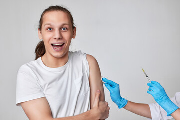 young man during coronavirus vaccination, covid-19 immunization.