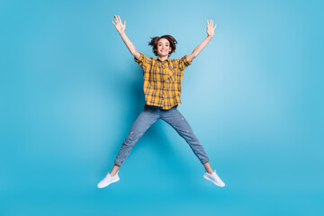 Obraz premium Photo of funny dream positive lady jump wear checkered shirt jeans footwear isolated blue color background