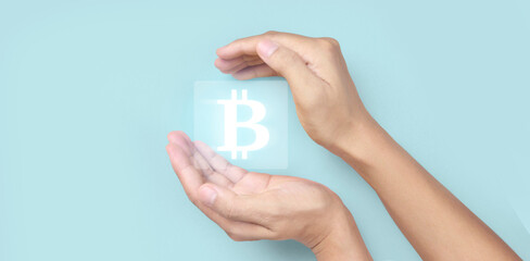 Hands showing bitcoin icon as virtual money digital