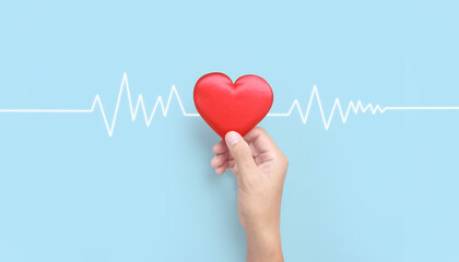 Hands holding red heart. heart health donation concepts