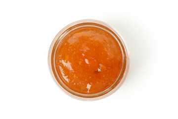 Jar of peach jam isolated on white background, top view