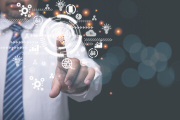 A businessman use finger pushing button touch screen internet online in the future. Presentation idea innovation by use internet online network. Concept Business, technology, social media.