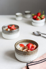 Strawberry, cream cheese and feta cream and crumble crust dessert. Homemade Sweet and salty cheesecake. Trifle. Selective focus