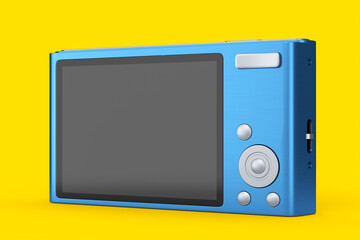 Stylish blue compact pocket digital camera isolated on yellow background