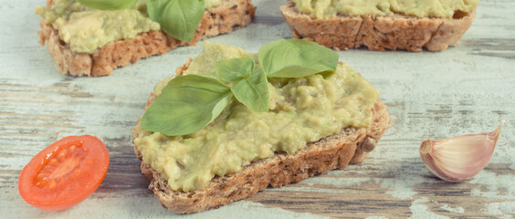 Sandwiches with paste of avocado. Healthy food as source omega acids, vitamins and minerals