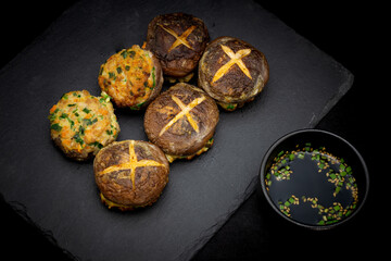 Korean food Pyogobeoseot-Jeon which is fried Shiitake mushroom with meatball