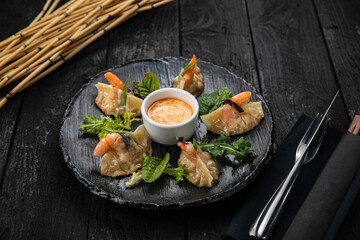 Japanese dumplings on a dark table in a japanese restaurant