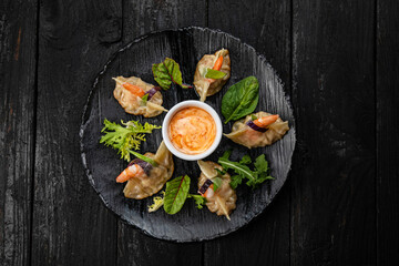 Japanese dumplings on a dark table in a japanese restaurant