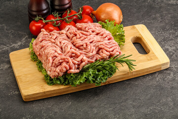 Raw pork minced meat over board