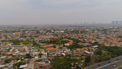 Aerial cityscape modern city Surabaya with highway, skyscrapers, buildings and houses. city skyline with skyscrapers and business centers Surabaya capital city east java, indonesia