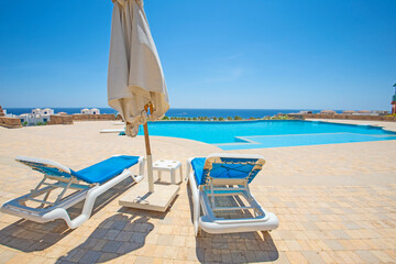 Fototapeta na wymiar Outdoor swimming pool in a luxury tropical hotel resort