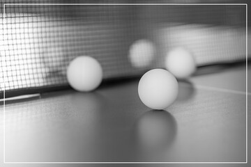Tennis balls on a blurred background.Black and white image.