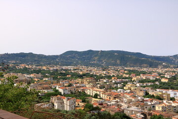 Fototapeta na wymiar Landscape of Sorrento, Naples, Italy, West Europe. View of village on the shore cliff. Mediterranean Sea.