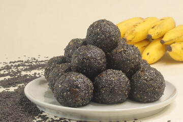 Traditional Indian sweet balls made with sesame seeds, jaggery and coconut, commonly known as Til ke laddu or sesame ladoos