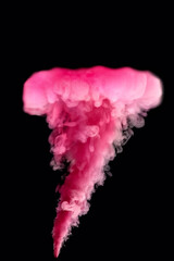 Freeze motion. Pink jet on a black background. Explosion simulation. Abstract, blurred background. Photo