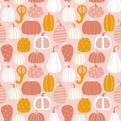 Seamless background with pumpkins in the autumn color palette. Flat cartoon style.