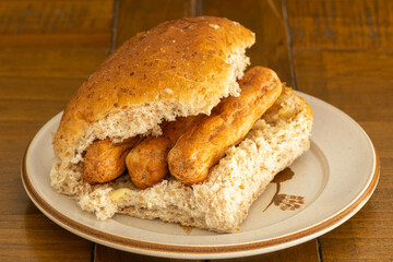 A wheaten and oatmeal roll with scottish Link Sausages
