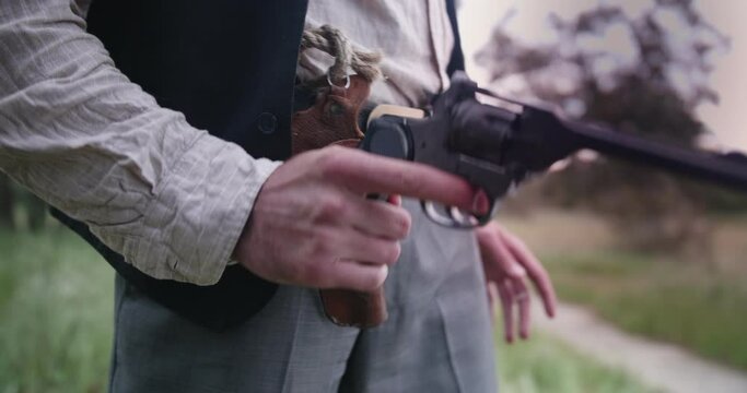Closeup of a Cowboy Drawing Pistol In A Duel
