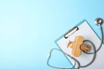  Pediatrics concept. Stethoscope and toy on a light background