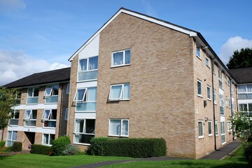 Town centre private apartments built in the 1960s with communal grounds