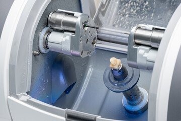 CAD CAM dental computer-aided machine. Digital modern dental laboratory for prosthesis and crowns...