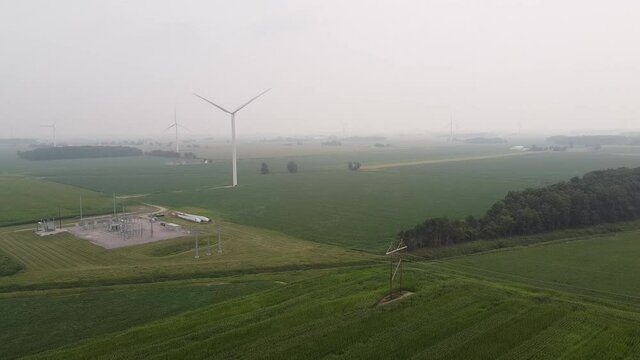 Windmill Within DTE Wind Farm During White Cloudy Day In Ithaca, Gratiot County, Michigan. wide shot