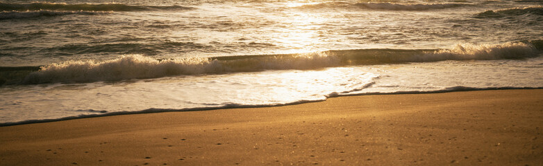 shadow on the beach.Caribbean sea and Ocean wave breaking to beach. sunrise and dramatic colorful sky clouds.