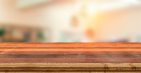 Wooden board empty table in front of blurred background. Perspective brown wood over blur in coffee shop - can be used for display or montage your products.Mock up for display of product