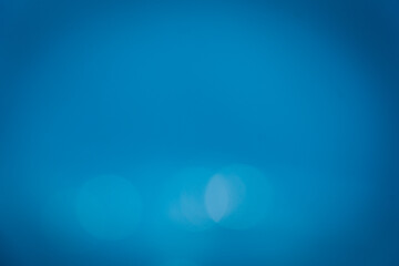 Blur summer sparkling sea water.Blue pattern backgrounds.Texture and wallpaper white circle.