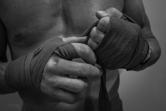 Boxer man holding his hands - Powered by Adobe