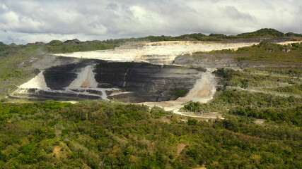 Open pit limestone quarry in the mountains of Bohol Island, Philippines. limestone quarry view from...