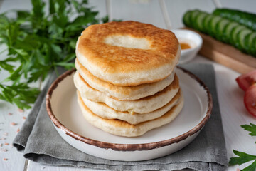 A hearty snack: Tortillas with cheese on a white plate. Close-up