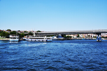 Panoramic view of the Bosphorus. View of the strait, large bridge and pleasure ships. July 11, 2021, Istanbul, Turkey.