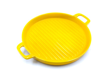 Yellow clay dishes for baking on a white background.