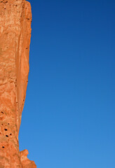 Edge of North Gateway Rock - Red rock face of the edge of North Gateway Rock with a clear blue sky area that is perfect for placing copy. Garden of the Gods, Colorado Springs, El Paso County