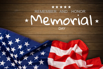 Fototapeta na wymiar Happy Memorial Day. American flags with the text REMEMBER HONOR against a blackboard background. 
