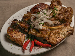 Fried ribs with spices and vegetables