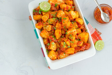 Baked Potatoes in a Baking Tray Directly Above Photo