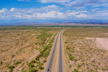 Panoramic view of speed road through the wilderness valley mountains landscape with cactus in the Arizona