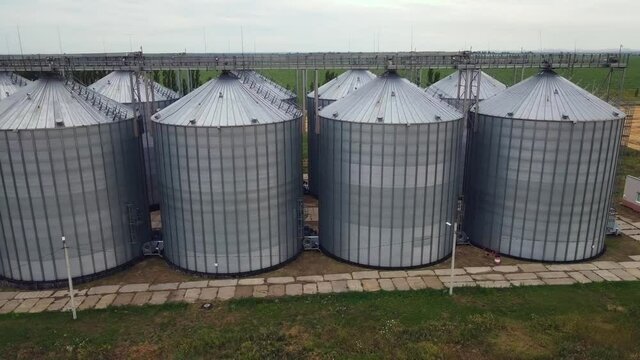 Grain elevator and agricultural storage. Containers silos storing agriculture crop in countryside