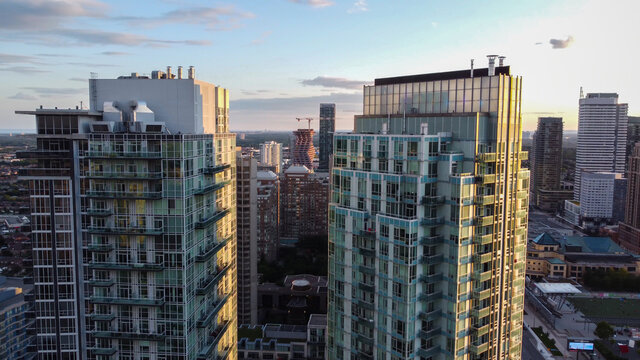 Aerial shot of downtown Mississauga during late afternoon before sunset on a summer day. City Centre, Celebration Square and high-rise condominiums.
