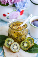 kiwi jam and kiwi slices in jar