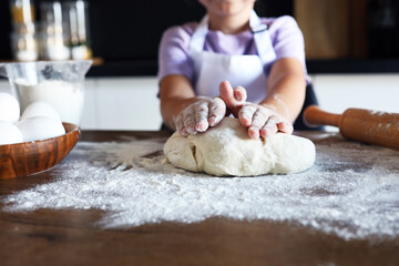 Sweet little cute girl is learning how to make a cake, in the home kitchen, Family concept, Vintage color tone. Top view