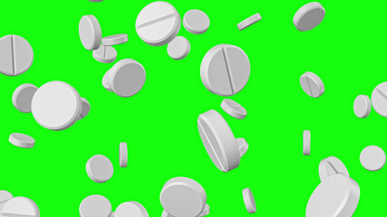 White round pills falling on a green background. Pharmaceutical concept.