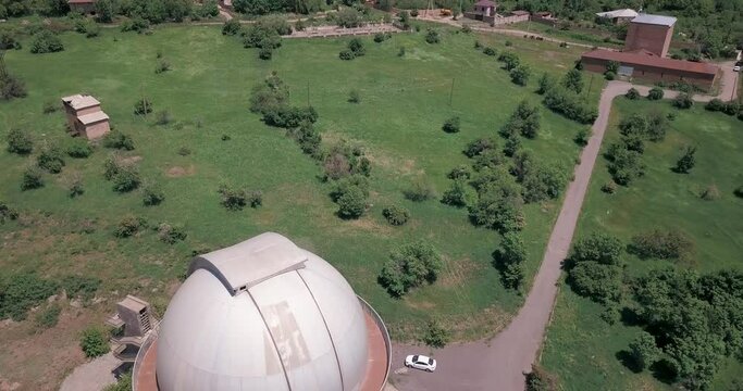 Video of a drone flying over a mountain observatory in the city of Byurakan, Armenia.