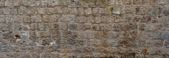 Wall made with many tuff bricks. Wall of tuff stone.